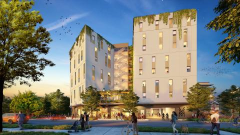 Rendering of an unadorned, contemporary, 5-story apartment complex. It has two towers set at angles to each other and a third section in back. It has a flat roof and a flat awning over its first floor.